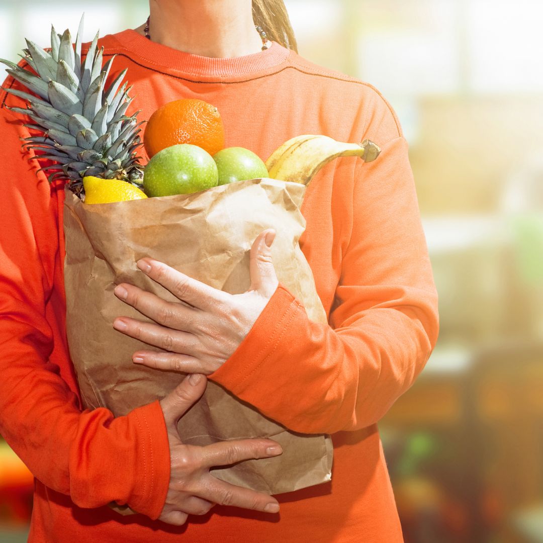 woman holding healthy groceries