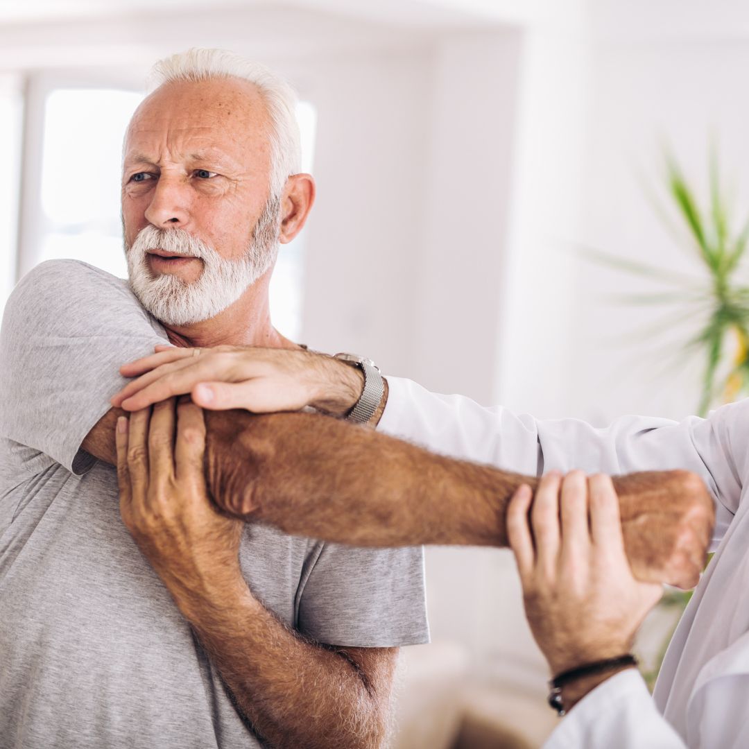 Elderly man stretching