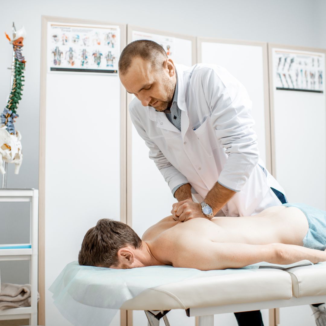 chiropractor pressing on back