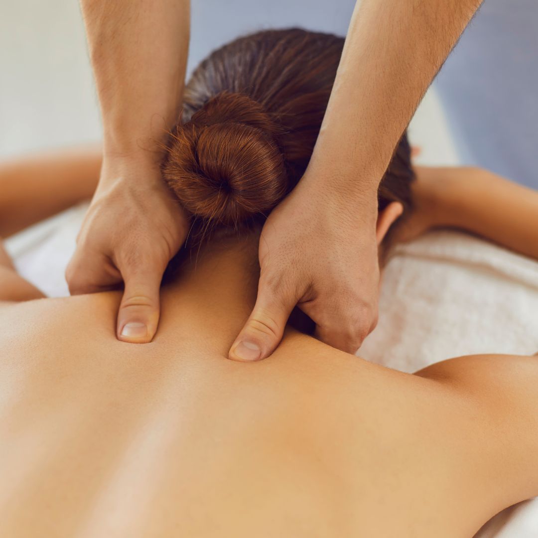 massaging woman's neck