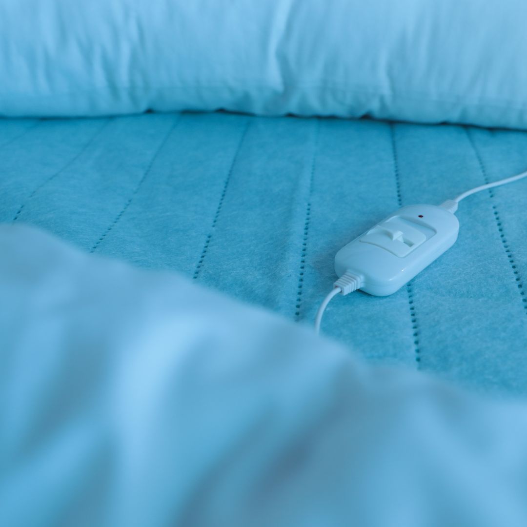 close up of a heating pad on a bed
