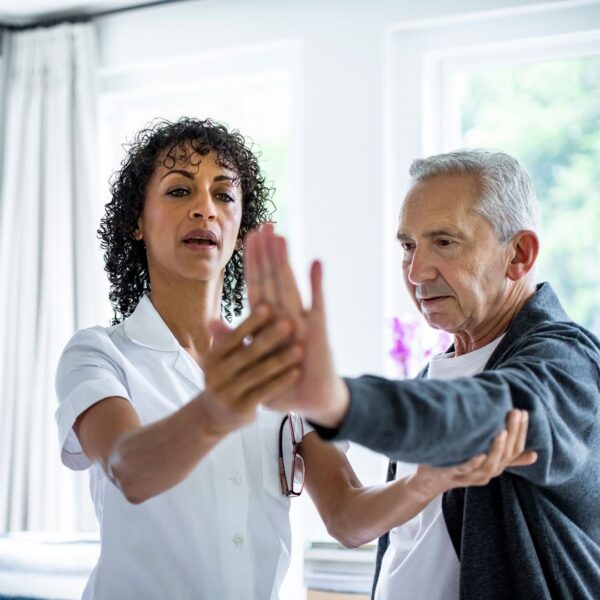 physical therapist working with patient