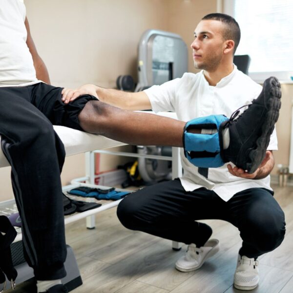physical therapist working with patient