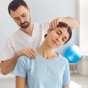 physical therapist working on patient's neck