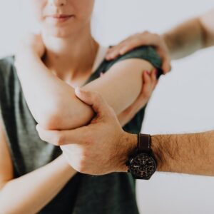 chiropractor working with patient