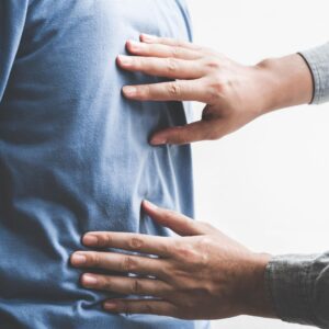 chiropractor working with patient's back