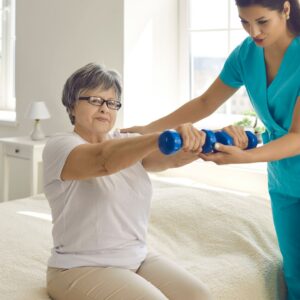 physical therapist working with woman