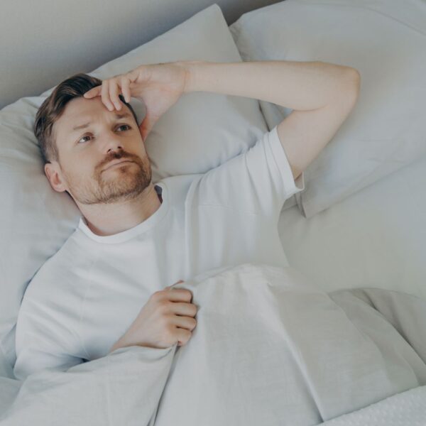 man struggling to sleep