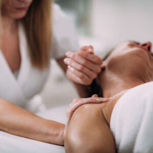 massaging shoulder and neck 