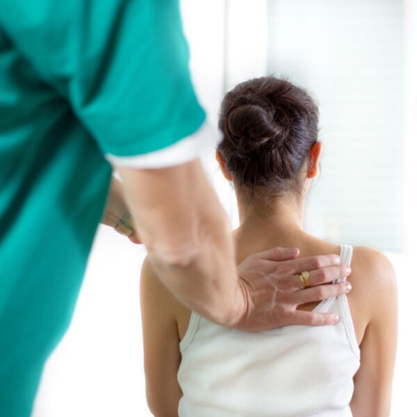 chiropractor with patient