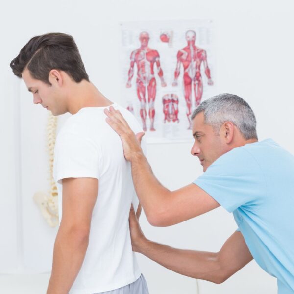 chiropractor with patient