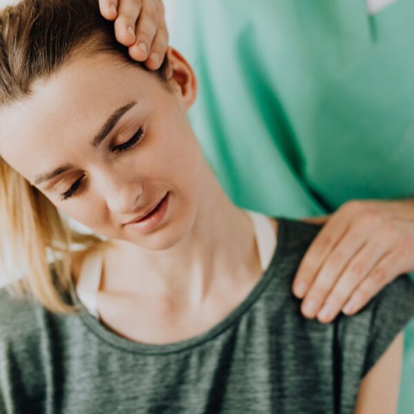 chiropractor with patient