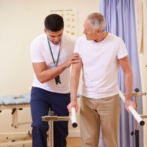 man getting physical therapy