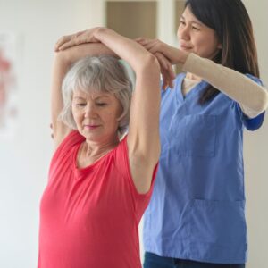 woman and physical therapist