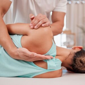 athletic woman receiving chiropractic treatment