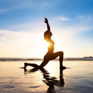 athletic woman on the posing on the beach