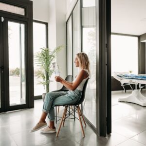 A woman waiting in a wellness center waiting room
