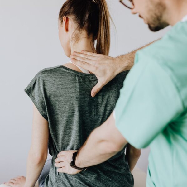 person receiving chiropractic analysis
