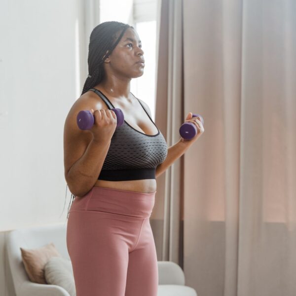 woman lifting light weights