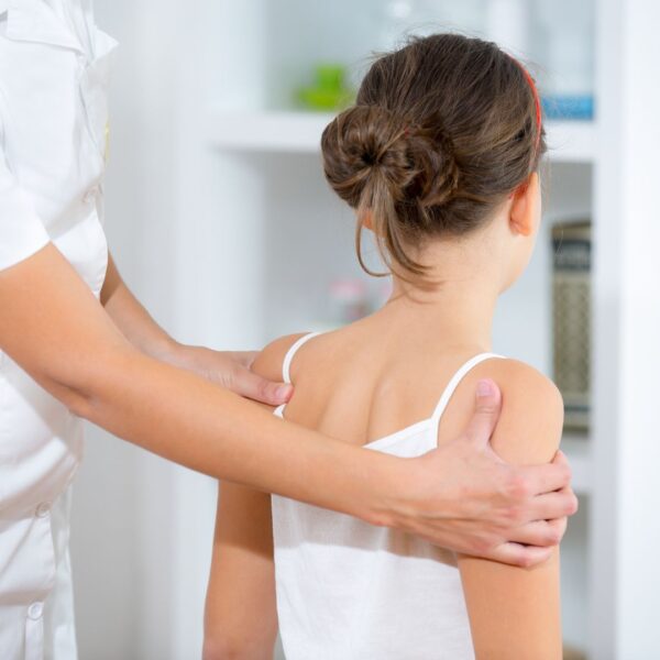 a young girl getting an adjustment