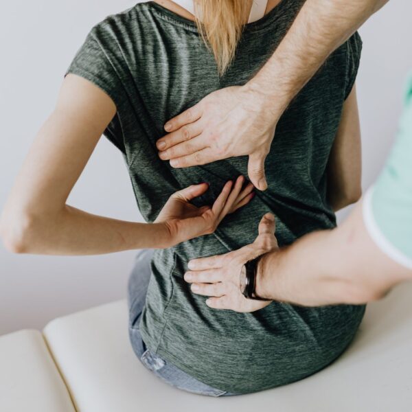 a woman getting her back adjusted